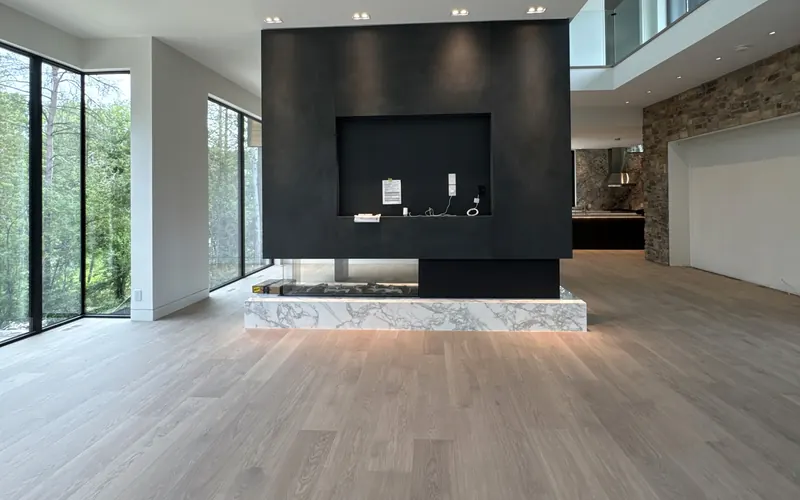 Light engineered oak flooring in a modern open-plan Toronto condo