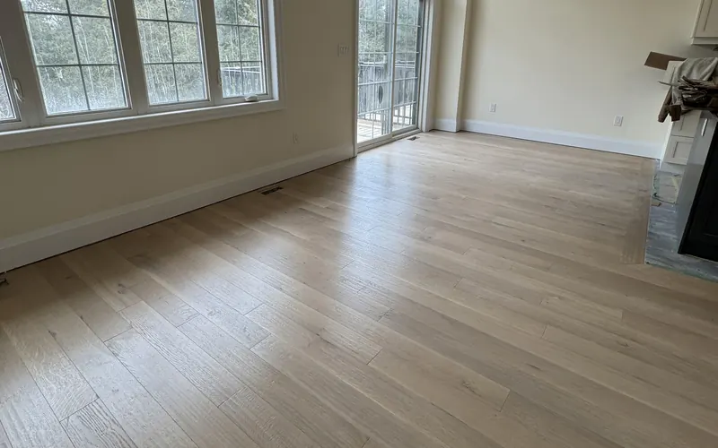 Wide-plank engineered white oak floor installed in a bright Toronto living room