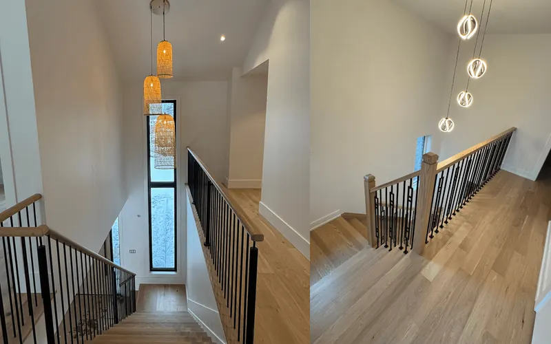 Renovated oak staircase with new hardwood treads and black metal railings in a Toronto home
